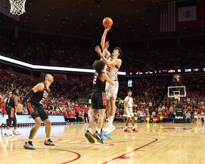 Feb 17, 2024; Ames, Iowa, USA; Iowa State Cyclones forward Milan Momcilovic (22) shoots the ball against Texas Tech Red Raiders guard Pop Isaacs (2) during the first half at James H. Hilton Coliseum. Mandatory Credit: Reese Strickland-USA TODAY Sports