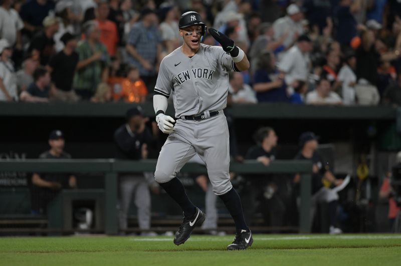 Jul 29, 2023; Baltimore, Maryland, USA; New York Yankees right fielder Aaron Judge (99) waves teammates home during the sixth inning against the Baltimore Orioles  at Oriole Park at Camden Yards. Mandatory Credit: Tommy Gilligan-USA TODAY Sports