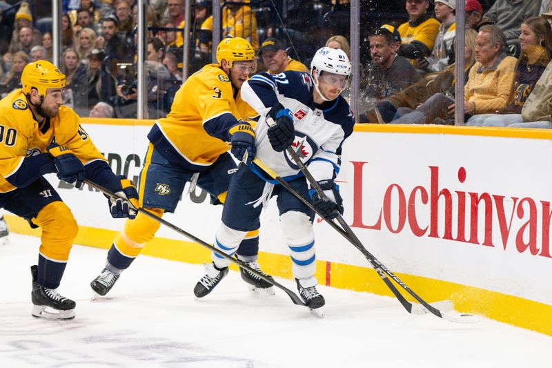 Nov 23, 2024; Nashville, Tennessee, USA;  Nashville Predators defenseman Jeremy Lauzon (3) and Winnipeg Jets left wing Kyle Connor (81) fight for the puck during the second period at Bridgestone Arena. Mandatory Credit: Steve Roberts-Imagn Images