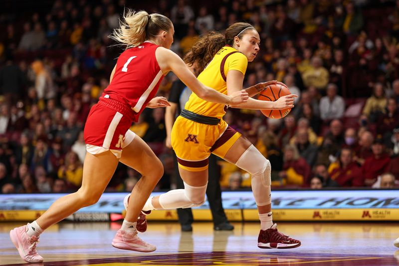 Jan 14, 2024; Minneapolis, Minnesota, USA; Minnesota Golden Gophers guard Amaya Battle (3) works around Nebraska Cornhuskers guard Jaz Shelley (1) during the first half at Williams Arena. Mandatory Credit: Matt Krohn-USA TODAY Sports