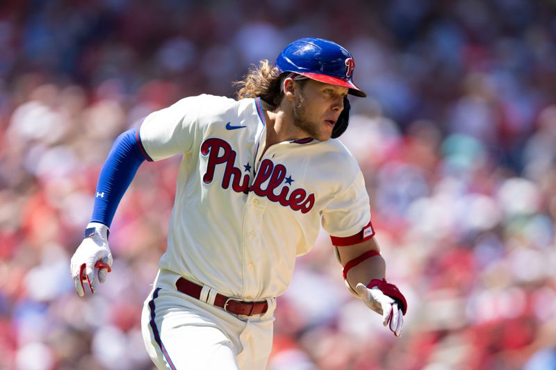 Aug 13, 2023; Philadelphia, Pennsylvania, USA; Philadelphia Phillies first baseman Alec Bohm (28) runs the bases after hitting a single during the first inning against the Minnesota Twins at Citizens Bank Park. Mandatory Credit: Bill Streicher-USA TODAY Sports