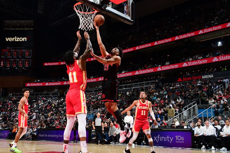 ATLANTA, GA - JANUARY 28: Jordan Nwora #13 of the Toronto Raptors drives to the basket during the game against the Atlanta Hawks on January 28, 2024 at State Farm Arena in Atlanta, Georgia.  NOTE TO USER: User expressly acknowledges and agrees that, by downloading and/or using this Photograph, user is consenting to the terms and conditions of the Getty Images License Agreement. Mandatory Copyright Notice: Copyright 2024 NBAE (Photo by Scott Cunningham/NBAE via Getty Images)