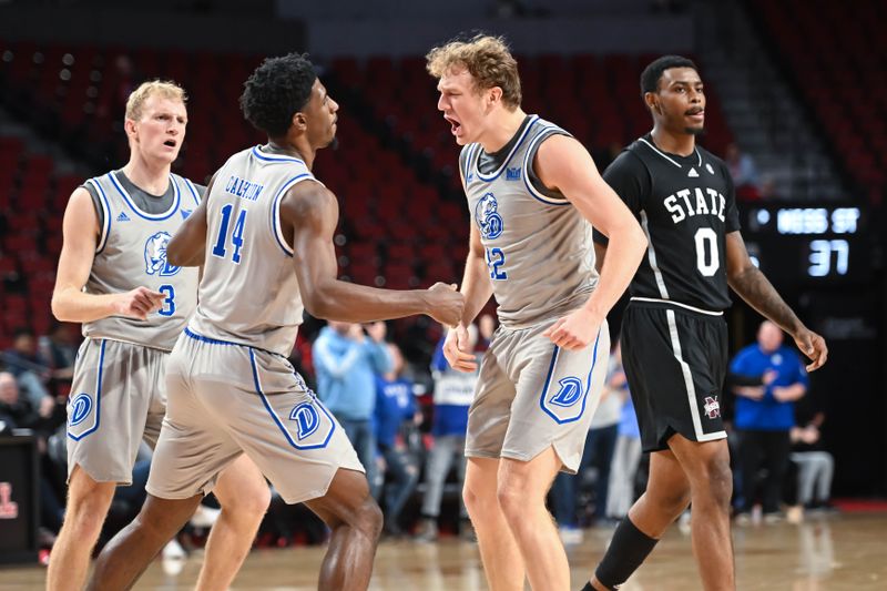 Dec 20, 2022; Lincoln, Nebraska, USA;  Drake Bulldogs guard Tucker DeVries (12) reacts with guard Sardaar Calhoun (14) after taking the lead against the Mississippi State Bulldogs in the second half at Pinnacle Bank Arena. Mandatory Credit: Steven Branscombe-USA TODAY Sports