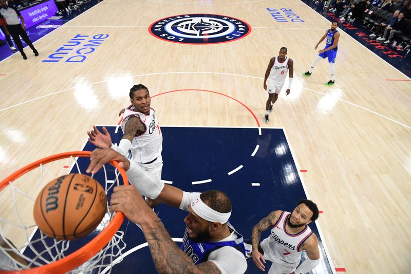 INGLEWOOD, CA - OCTOBER 14: Daniel Gafford #21 of the Dallas Mavericks dunks the ball during the game against the LA Clippers during a NBA Preseason game on October 14, 2024 at the Intuit Dome in Inglewood, California. NOTE TO USER: User expressly acknowledges and agrees that, by downloading and/or using this Photograph, user is consenting to the terms and conditions of the Getty Images License Agreement. Mandatory Copyright Notice: Copyright 2024 NBAE (Photo by Adam Pantozzi/NBAE via Getty Images)
