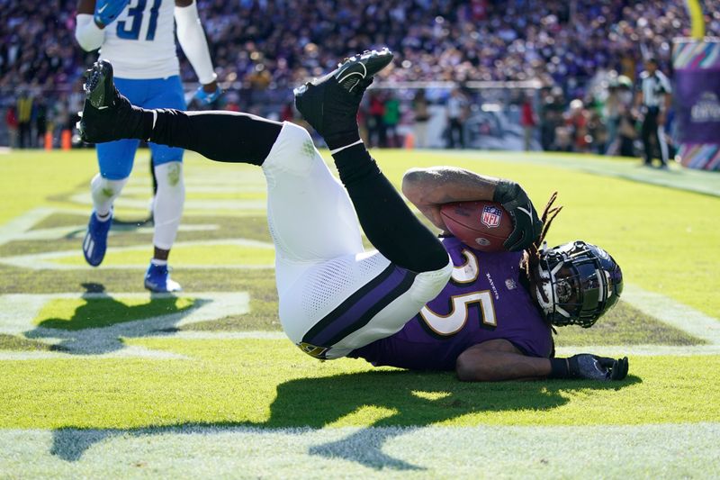 Baltimore Ravens running back Gus Edwards falls into the endzone for a two-yard rushing touchdown during the first half of an NFL football game against the Detroit Lions, Sunday, Oct. 22, 2023, in Baltimore. (AP Photo/Alex Brandon)