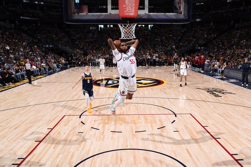 DENVER, CO - OCTOBER 26: Derrick Jones Jr. #55 of the LA Clippers dunks the ball during the game against the Denver Nuggets on October 26, 2024 at the Ball Arena in Denver, Colorado. NOTE TO USER: User expressly acknowledges and agrees that, by downloading and/or using this Photograph, user is consenting to the terms and conditions of the Getty Images License Agreement. Mandatory Copyright Notice: Copyright 2024 NBAE (Photo by Garrett Ellwood/NBAE via Getty Images)