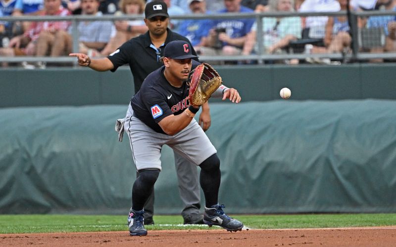 Jun 27, 2024; Kansas City, Missouri, USA; Cleveland Guardians first baseman Josh Naylor (22) fields the ball in the first inning against the Kansas City Royals at Kauffman Stadium. Mandatory Credit: Peter Aiken-USA TODAY Sports