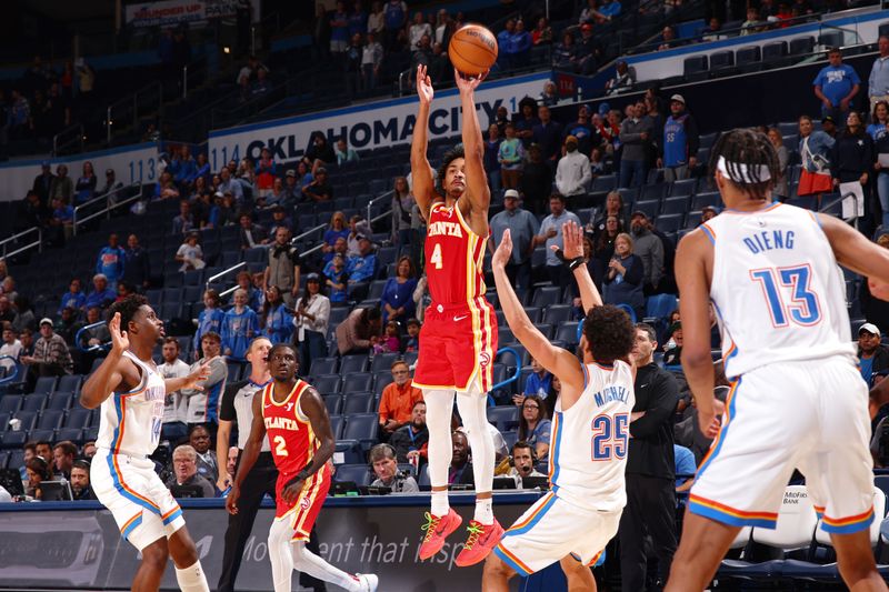 OKLAHOMA CITY, OK - OCTOBER 17: Kobe Bufkin #4 of the Atlanta Hawks shoots a three point basket during the game against the Oklahoma City Thunder on October 17, 2024 at Paycom Arena in Oklahoma City, Oklahoma. NOTE TO USER: User expressly acknowledges and agrees that, by downloading and or using this photograph, User is consenting to the terms and conditions of the Getty Images License Agreement. Mandatory Copyright Notice: Copyright 2024 NBAE (Photo by Zach Beeker/NBAE via Getty Images)