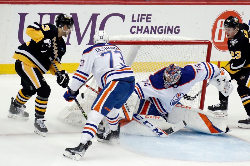 Feb 23, 2023; Pittsburgh, Pennsylvania, USA;  Edmonton Oilers goaltender Stuart Skinner (74) makes a save against Pittsburgh Penguins left wing Brock McGinn (23) during the second period at PPG Paints Arena. Edmonton won 7-2. Mandatory Credit: Charles LeClaire-USA TODAY Sports