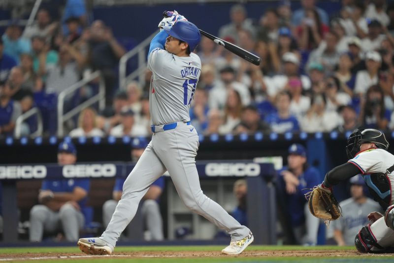 Sep 17, 2024; Miami, Florida, USA;  Los Angeles Dodgers designated hitter Shohei Ohtani (17) hits a two-run home run in the third inning against the Miami Marlins at loanDepot Park. Mandatory Credit: Jim Rassol-Imagn Images