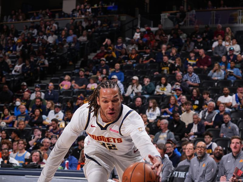 DENVER, CO - OCTOBER 13: Aaron Gordon #32 of the Denver Nuggets goes after the loose ball during the game against the Phoenix Suns on October 13, 2024 at Ball Arena in Denver, Colorado. NOTE TO USER: User expressly acknowledges and agrees that, by downloading and/or using this Photograph, user is consenting to the terms and conditions of the Getty Images License Agreement. Mandatory Copyright Notice: Copyright 2024 NBAE (Photo by Bart Young/NBAE via Getty Images)