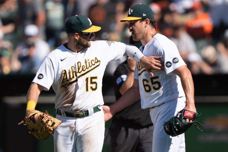 Aug 6, 2023; Oakland, California, USA;  Oakland Athletics left fielder Seth Brown (15) congratulates relief pitcher Trevor May (65) after defeating the San Francisco Giants at Oakland-Alameda County Coliseum. Mandatory Credit: Stan Szeto-USA TODAY Sports