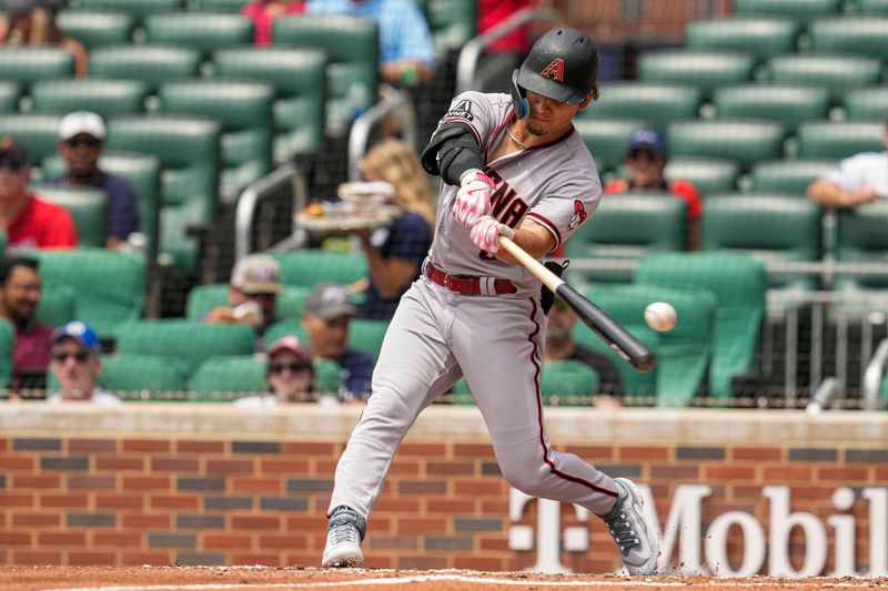 Jul 20, 2023; Cumberland, Georgia, USA; Arizona Diamondbacks center fielder Alek Thomas (5) strikes out against the Atlanta Braves during the third inning at Truist Park. Mandatory Credit: Dale Zanine-USA TODAY Sports