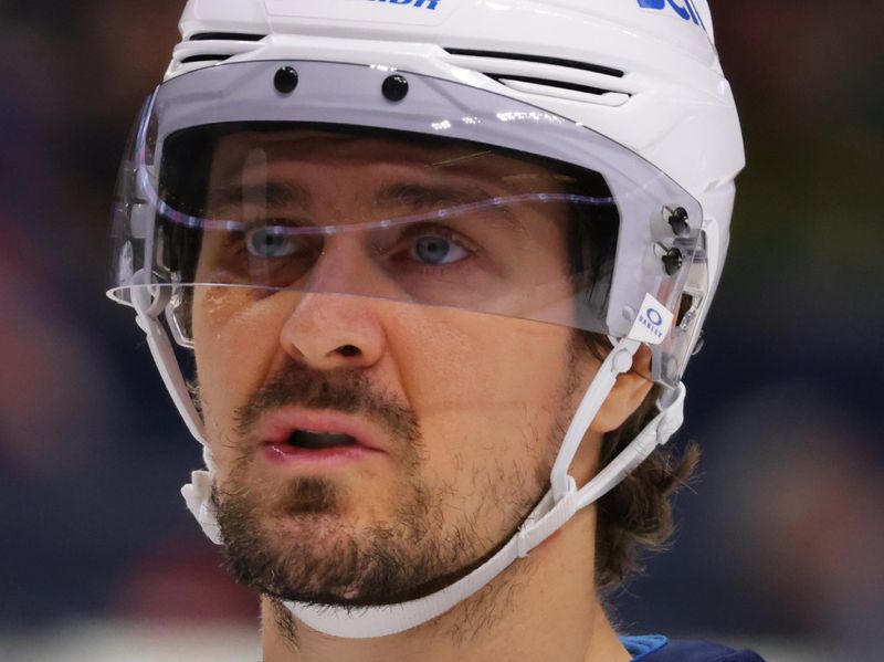 Dec 5, 2024; Buffalo, New York, USA;  Winnipeg Jets center Mark Scheifele (55) during a stoppage in play against the Buffalo Sabres during the second period at KeyBank Center. Mandatory Credit: Timothy T. Ludwig-Imagn Images