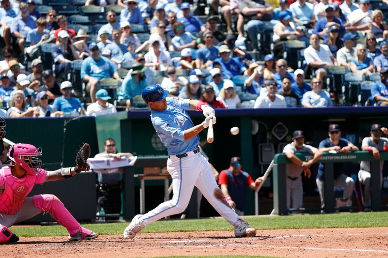 May 11, 2025; Kansas City, Missouri, USA; Kansas City Royals catcher Luke Maile (15) gets a base hit at Kauffman Stadium. Mandatory Credit: Gary Rohman-Imagn Images