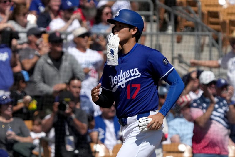 Mar 11, 2025; Phoenix, Arizona, USA; Los Angeles Dodgers player Shohei Ohtani (17) scores a run against the Cleveland Guardians in the first inning at Camelback Ranch-Glendale. Mandatory Credit: Rick Scuteri-Imagn Images