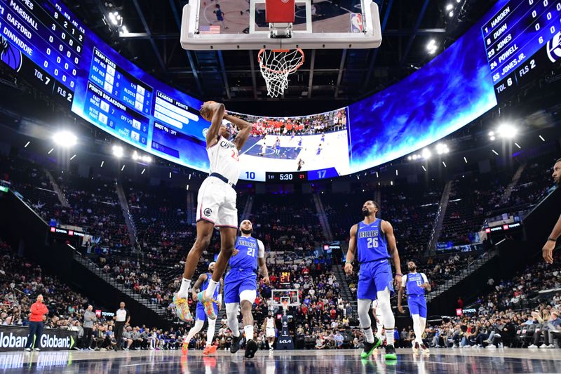 INGLEWOOD, CA - OCTOBER 14: Kai Jones #23 of the LA Clippers drives to the basket during the game against the Dallas Mavericks during a NBA Preseason game on October 14, 2024 at the Intuit Dome in Inglewood, California. NOTE TO USER: User expressly acknowledges and agrees that, by downloading and/or using this Photograph, user is consenting to the terms and conditions of the Getty Images License Agreement. Mandatory Copyright Notice: Copyright 2024 NBAE (Photo by Adam Pantozzi/NBAE via Getty Images)