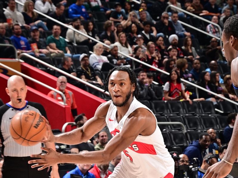 DETROIT, MI - MARCH 13: Immanuel Quickley #5 of the Toronto Raptors handles the ball during the game against the Detroit Pistons on March 13, 2024 at Little Caesars Arena in Detroit, Michigan. NOTE TO USER: User expressly acknowledges and agrees that, by downloading and/or using this photograph, User is consenting to the terms and conditions of the Getty Images License Agreement. Mandatory Copyright Notice: Copyright 2024 NBAE (Photo by Chris Schwegler/NBAE via Getty Images)