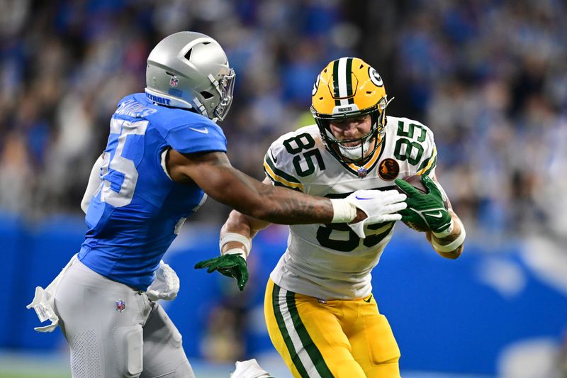 Detroit Lions linebacker Derrick Barnes (55) closes iin on Green Bay Packers tight end Tucker Kraft (85) during the first half of an NFL football game, Thursday, Nov. 23, 2023, in Detroit. (AP Photo/David Dermer)