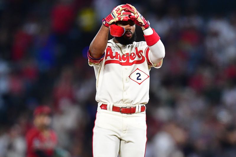 Jul 1, 2023; Anaheim, California, USA; Los Angeles Angels second baseman Luis Rengifo (2) reacts after hitting a double against the Arizona Diamondbacks during the fifth inning at Angel Stadium. Mandatory Credit: Gary A. Vasquez-USA TODAY Sports