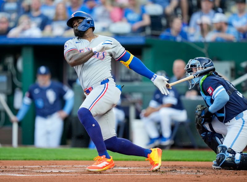 May 3, 2024; Kansas City, Missouri, USA; Texas Rangers outfielder Adolis García (53) hits a single against the Kansas City Royals during the first inning at Kauffman Stadium. Mandatory Credit: Jay Biggerstaff-USA TODAY Sports