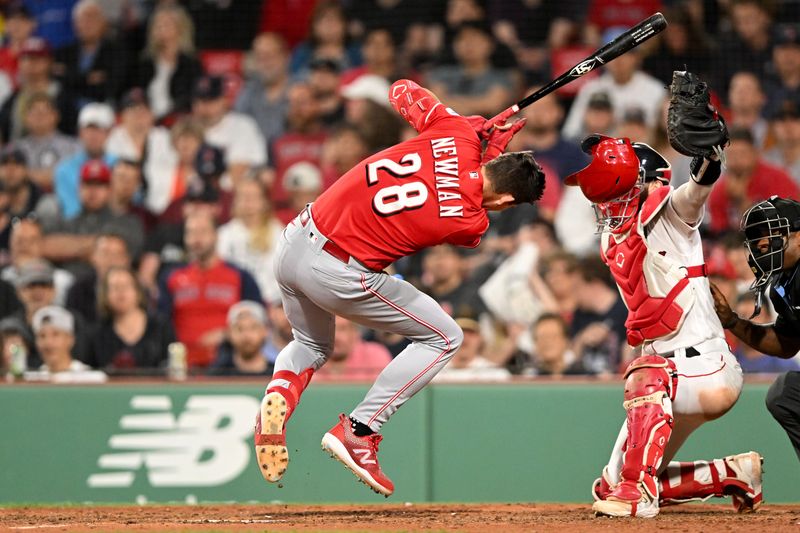 May 31, 2023; Boston, Massachusetts, USA; Cincinnati Reds shortstop Kevin Newman (28) is hit by a pitch thrown by Boston Red Sox starting pitcher Nick Pivetta (not seen) during the ninth inning at Fenway Park. Mandatory Credit: Brian Fluharty-USA TODAY Sports