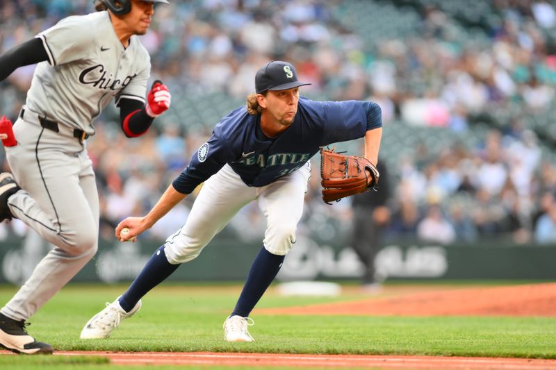 Jun 10, 2024; Seattle, Washington, USA; Seattle Mariners starting pitcher Logan Gilbert (36) throws the ball to first base for the force out on Chicago White Sox second baseman Nicky Lopez (8) during the third inning at T-Mobile Park. Mandatory Credit: Steven Bisig-USA TODAY Sports