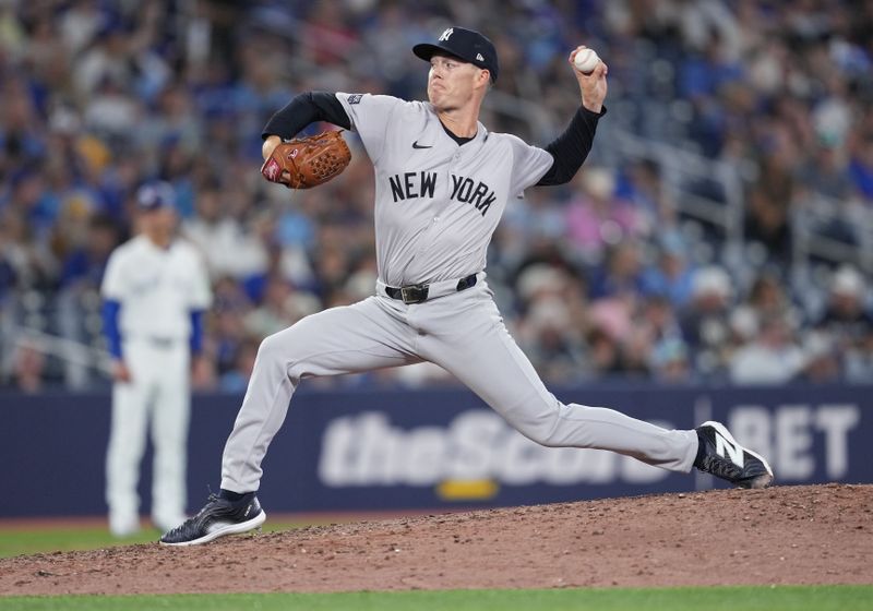 Jun 30, 2024; Toronto, Ontario, CAN; New York Yankees  relief pitcher Anthony Misiewicz (63) throws a pitch against the Toronto Blue Jays during the ninth inning at Rogers Centre. Mandatory Credit: Nick Turchiaro-USA TODAY Sports