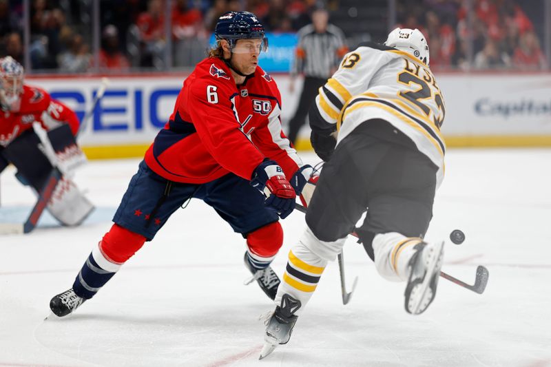 Oct 5, 2024; Washington, District of Columbia, USA; Washington Capitals defenseman Jakob Chychrun (6) blocks the shot of Boston Bruins right wing Fabian Lysell (23) in the second period at Capital One Arena. Mandatory Credit: Geoff Burke-Imagn Images