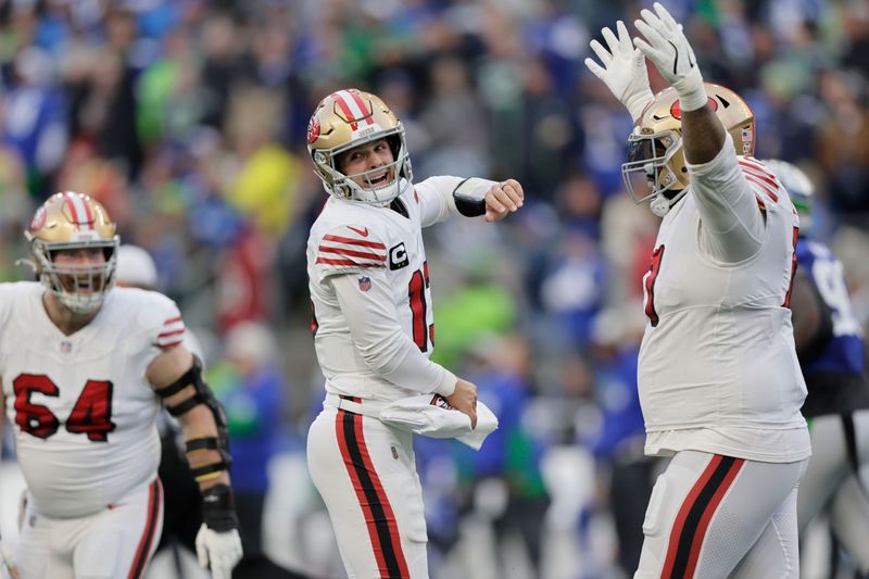 San Francisco 49ers quarterback Brock Purdy (13) react during the first half of an NFL football game against the Seattle Seahawks, Thursday, Oct. 10, 2024, in Seattle. (AP Photo/John Froschauer)