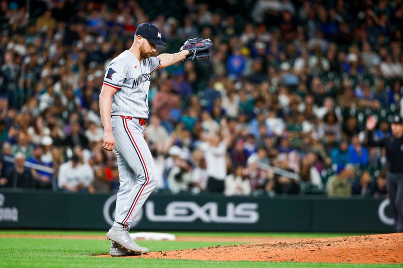 May 30, 2025; Seattle, Washington, USA; Minnesota Twins pitcher Brock Stewart (61) reacts following the final out against the Seattle Mariners of a 10-inning victory at T-Mobile Park. Mandatory Credit: Joe Nicholson-Imagn Images