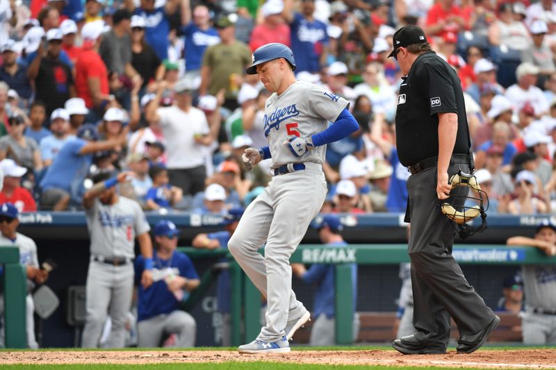 Jun 11, 2023; Philadelphia, Pennsylvania, USA; Los Angeles Dodgers first baseman Freddie Freeman (5) steps on home after hitting a solo home run against the Philadelphia Phillies during the sixth inning at Citizens Bank Park. Mandatory Credit: Eric Hartline-USA TODAY Sports