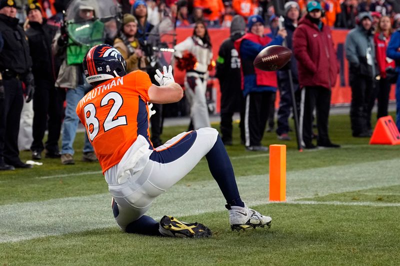 Denver Broncos tight end Adam Trautman catches a touchdown pass during the second half of an NFL football game against the Cleveland Browns on Sunday, Nov. 26, 2023, in Denver. (AP Photo/Jack Dempsey)