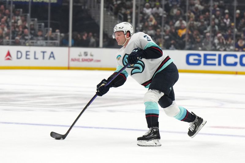 Dec 20, 2023; Los Angeles, California, USA; Seattle Kraken defenseman Will Borgen (3) shoots the puck against the LA Kings in the first period at Crypto.com Arena. Mandatory Credit: Kirby Lee-USA TODAY Sports