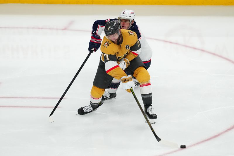 Jan 30, 2025; Las Vegas, Nevada, USA; Vegas Golden Knights defenseman Alex Pietrangelo (7) swings the puck away from Columbus Blue Jackets center Cole Sillinger (4) during the third period at T-Mobile Arena. Mandatory Credit: Stephen R. Sylvanie-Imagn Images