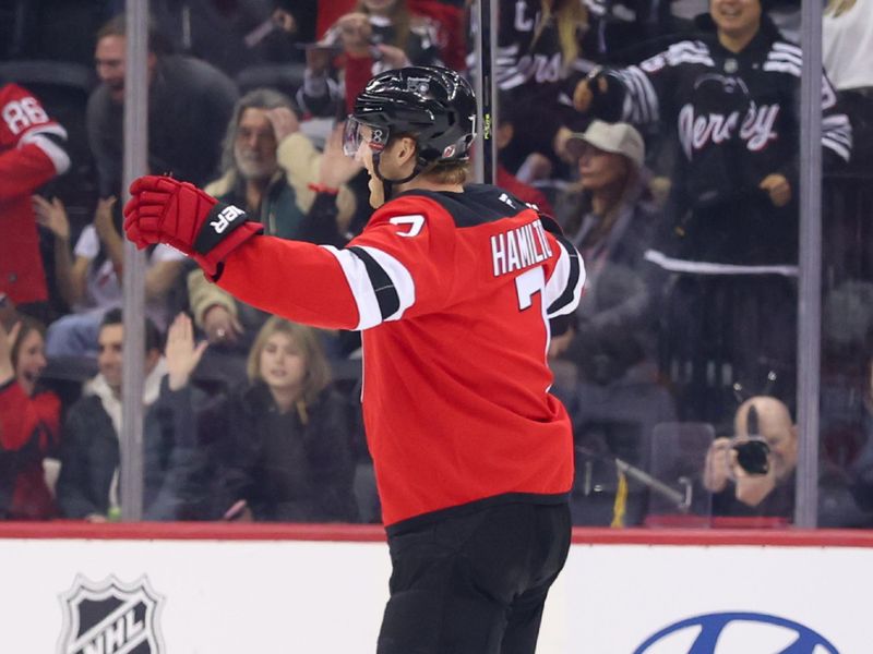 Jan 18, 2025; Newark, New Jersey, USA; New Jersey Devils defenseman Dougie Hamilton (7) celebrates his goal against the Philadelphia Flyers during the first period at Prudential Center. Mandatory Credit: Ed Mulholland-Imagn Images