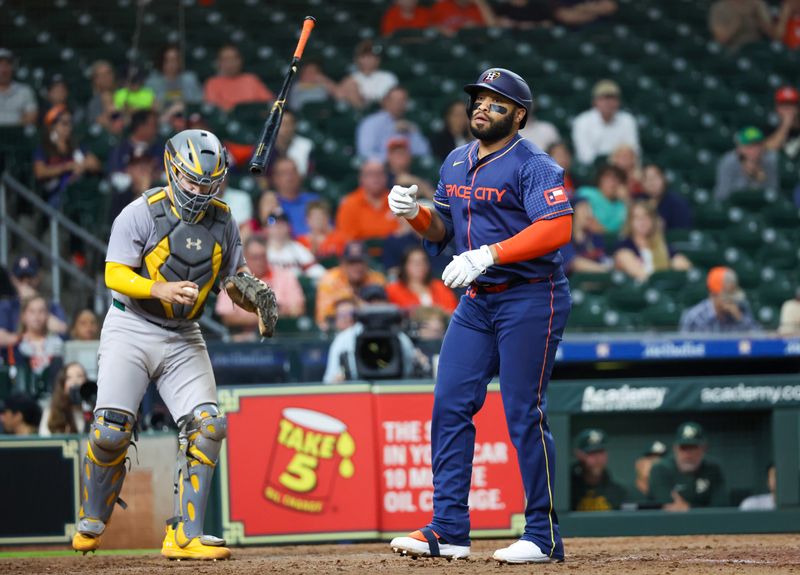 May 13, 2024; Houston, Texas, USA; Houston Astros first baseman Jon Singleton (28) walks to load the bases against the Oakland Athletics in the eighth inning at Minute Maid Park. Mandatory Credit: Thomas Shea-USA TODAY Sports