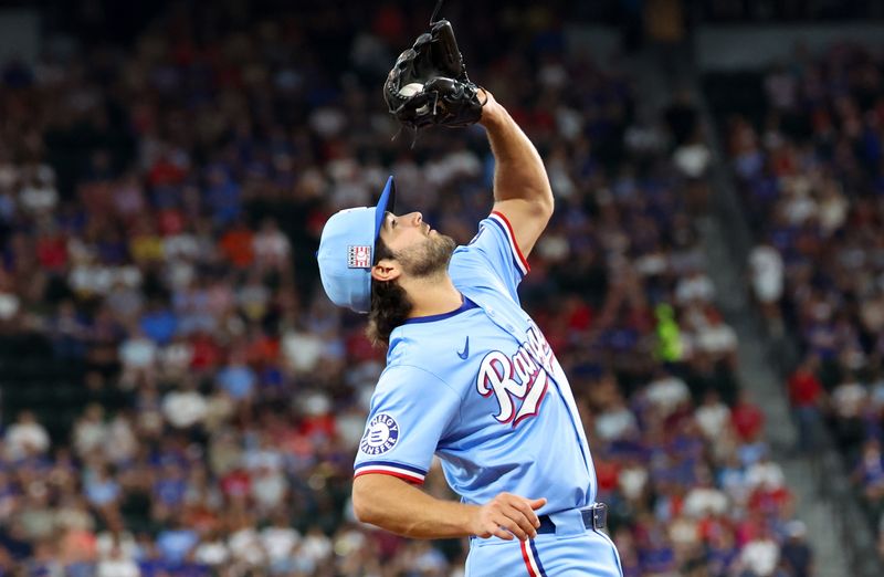 Jul 21, 2024; Arlington, Texas, USA;  Texas Rangers third baseman Josh Smith (8) makes a catch during the third inning against the Baltimore Orioles at Globe Life Field. Mandatory Credit: Kevin Jairaj-USA TODAY Sports
