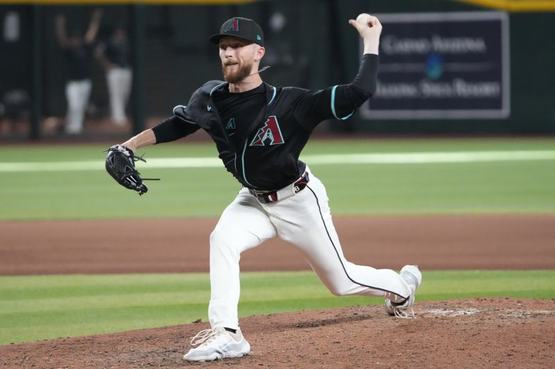 Jun 29, 2025; Phoenix, Arizona, USA; Arizona Diamondbacks pitcher Kyle Backhus (43) pitches against the Miami Marlins during the seventh inning at Chase Field. Mandatory Credit: Joe Camporeale-Imagn Images