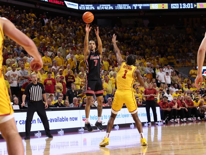 Feb 16, 2026; Ames, Iowa, USA; Iowa State Cyclones guard Anthony Rise (7) shoots over Iowa State Cyclones guard Jamarion Batemon (1) during the second half at James H. Hilton Coliseum. Mandatory Credit: Reese Strickland-Imagn Images