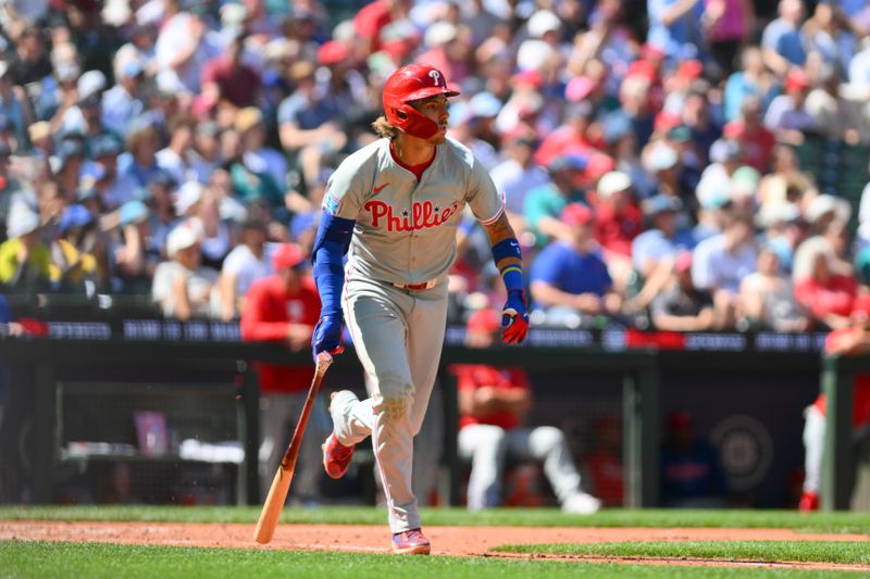 Aug 4, 2024; Seattle, Washington, USA; Philadelphia Phillies second baseman Bryson Stott (5) runs towards first base after hitting a home run against the Seattle Mariners during the eighth inning at T-Mobile Park. Mandatory Credit: Steven Bisig-USA TODAY Sports