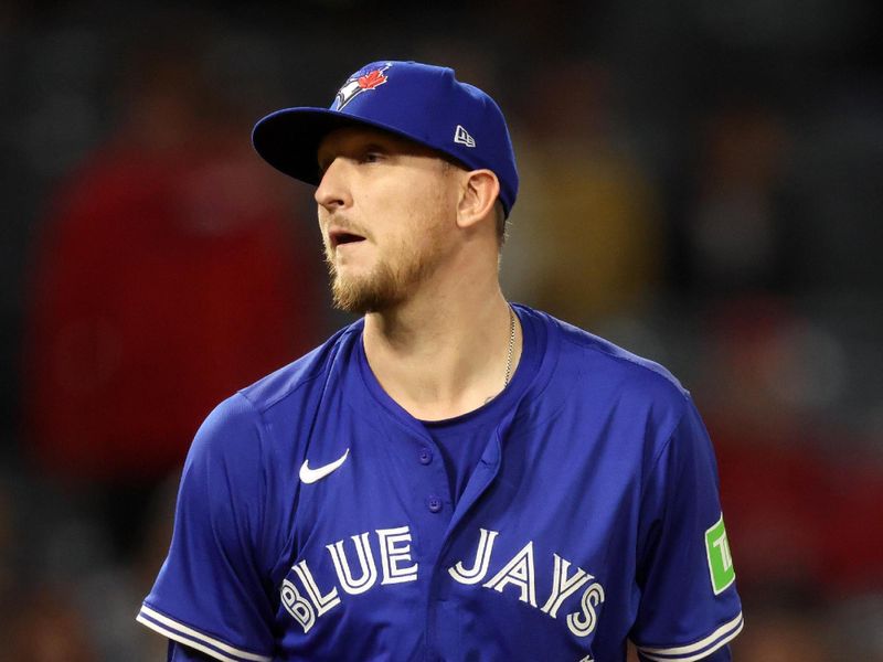 May 7, 2025; Anaheim, California, USA;  Toronto Blue Jays relief pitcher Jeff Hoffman (23) pitches during the ninth inning against the Los Angeles Angels at Angel Stadium. Mandatory Credit: Kiyoshi Mio-Imagn Images