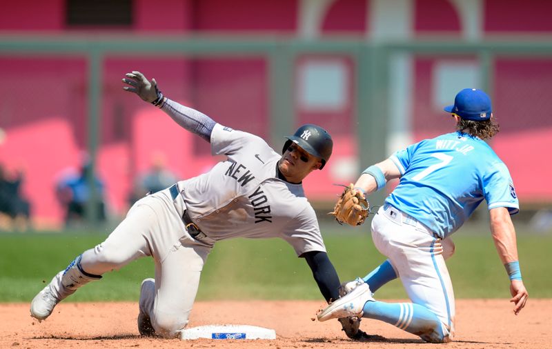 Jun 13, 2024; Kansas City, Missouri, USA; New York Yankees right fielder Juan Soto (22) is tagged out a second base by Kansas City Royals shortstop Bobby Witt Jr. (7) during the eighth inning at Kauffman Stadium. Mandatory Credit: Jay Biggerstaff-USA TODAY Sports