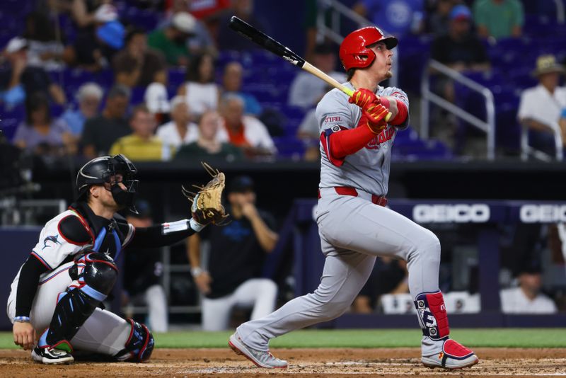 Jun 19, 2024; Miami, Florida, USA; St. Louis Cardinals second baseman Nolan Gorman (16) hits a home run against the Miami Marlins during the second inning at loanDepot Park. Mandatory Credit: Sam Navarro-USA TODAY Sports