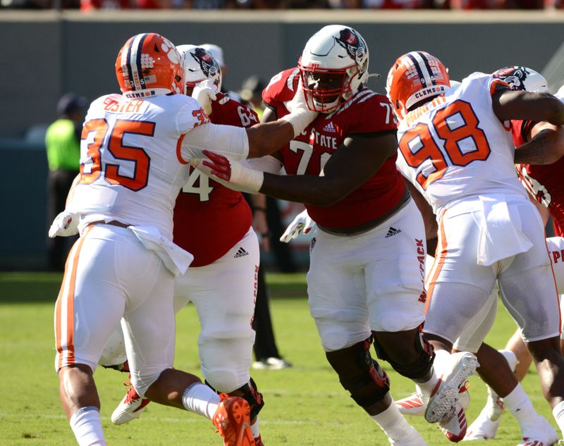 Sep 25, 2021; Raleigh, North Carolina, USA; North Carolina State Wolfpack tackle Ikem Ekwonu (79) blocks Clemson Tigers defensive end Justin Foster (35) during the first half at Carter-Finley Stadium. Mandatory Credit: Rob Kinnan-USA TODAY Sports