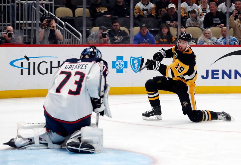 Mar 5, 2024; Pittsburgh, Pennsylvania, USA; Columbus Blue Jackets goaltender Jet Greaves (73)  makes a save against Pittsburgh Penguins right wing Reilly Smith (19) during the third period at PPG Paints Arena. The Penguins won 5-3. Mandatory Credit: Charles LeClaire-USA TODAY Sports