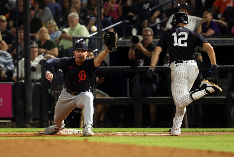 Feb 27, 2023; Tampa, Florida, USA; Detroit Tigers right fielder Austin Meadows (17) forces out New York Yankees shortstop Isiah Kiner-Falefa (12) during the third inning at George M. Steinbrenner Field. Mandatory Credit: Kim Klement-USA TODAY Sports