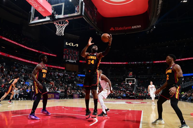 ATLANTA, GA - JANUARY 20: Bruno Fernando #24 of the Atlanta Hawks grabs a rebound during the game against the Cleveland Cavaliers on January 20, 2024 at State Farm Arena in Atlanta, Georgia.  NOTE TO USER: User expressly acknowledges and agrees that, by downloading and/or using this Photograph, user is consenting to the terms and conditions of the Getty Images License Agreement. Mandatory Copyright Notice: Copyright 2024 NBAE (Photo by Scott Cunningham/NBAE via Getty Images)