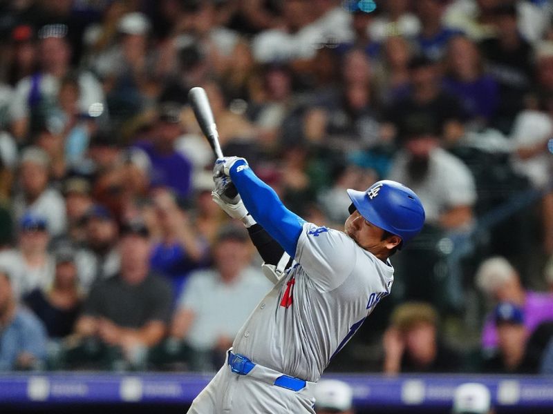 Sep 28, 2024; Denver, Colorado, USA; Los Angeles Dodgers designated hitter Shohei Ohtani (17) swings in the fifth inning against the Colorado Rockies at Coors Field. Mandatory Credit: Ron Chenoy-Imagn Images