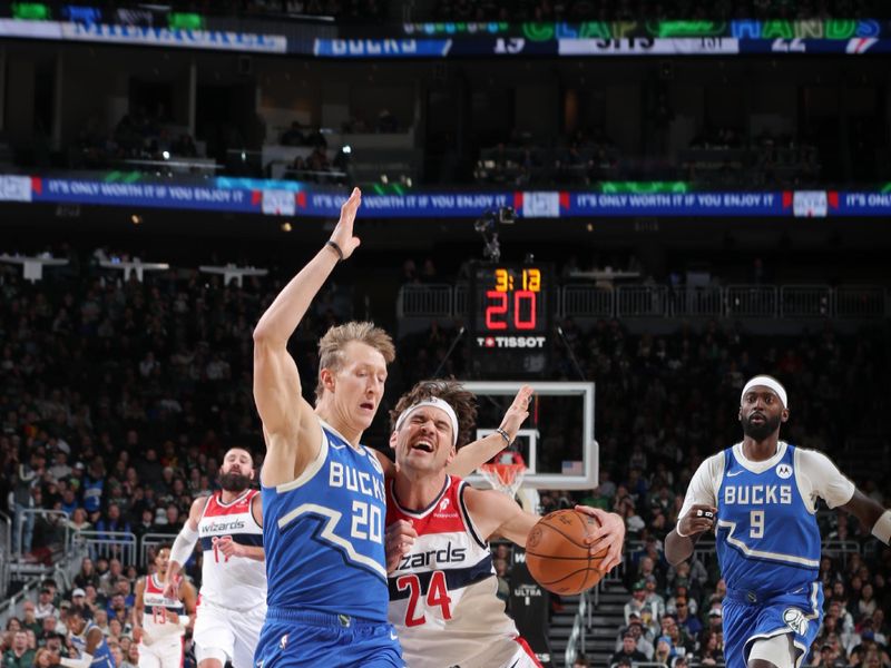 MILWAUKEE, WI - NOVEMBER 30: Corey Kispert #24 of the Washington Wizards drives to the basket during the game against the Milwaukee Bucks on November 30, 2024 at Fiserv Forum Center in Milwaukee, Wisconsin. NOTE TO USER: User expressly acknowledges and agrees that, by downloading and or using this Photograph, user is consenting to the terms and conditions of the Getty Images License Agreement. Mandatory Copyright Notice: Copyright 2024 NBAE (Photo by Gary Dineen/NBAE via Getty Images).